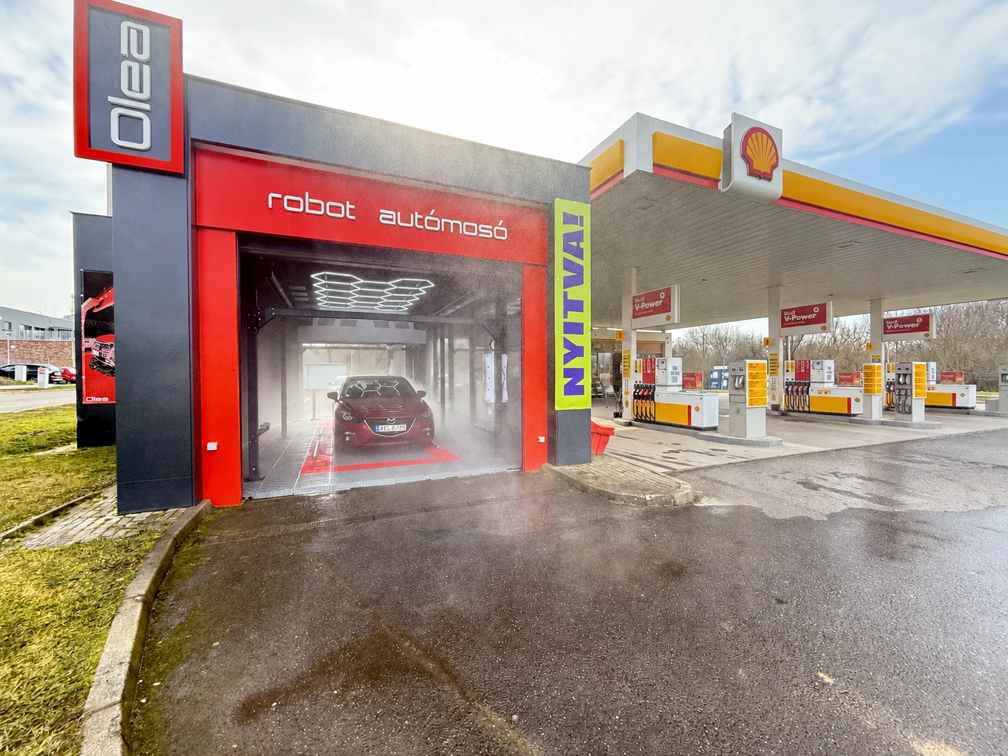 OLEA robot car wash in operation next to a Shell filling station